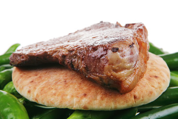 roasted red meat steak over arabic bread