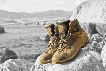 closeup touristic boots on a grayscale background