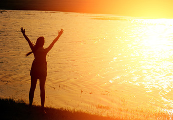 Fototapeta premium The girl embrace the sun