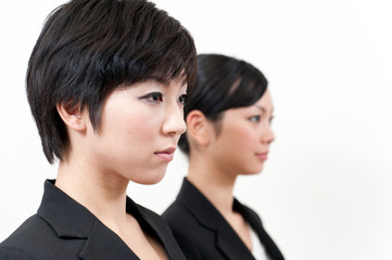 two asian businesswomen standing