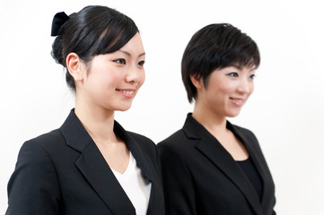 two asian businesswomen standing