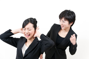 two asian businesswomen in trouble