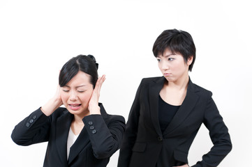 two asian businesswomen in trouble