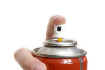 finger pressing a button spray