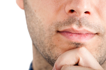 Fototapeta premium Closeup of a young thoughtful man's lips and chin