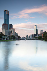 Melbourne skyline across the Yara River with single sculler © gb27photo