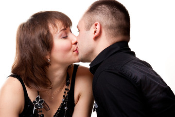 Portrait of a beautiful young happy couple kissing