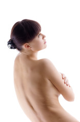 Nude woman posing on white