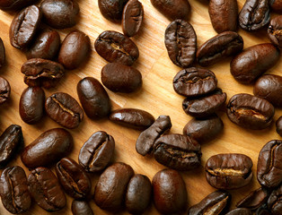 Coffee beans on wooden background