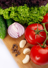 Fresh vegetables on wooden hardboard