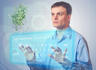 Young man with a virtual keyboard