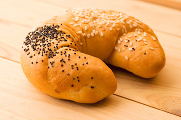 Bun isolated on wooden background