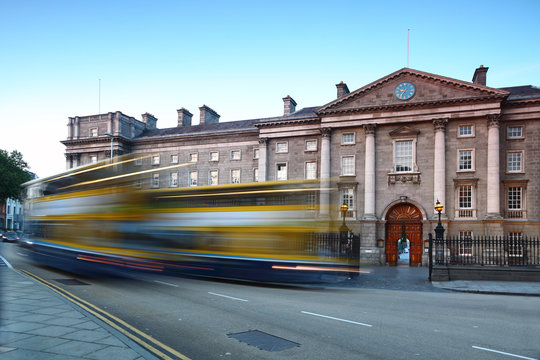 Trinity College at day in Dublin, Ireland. Bus quickly rides