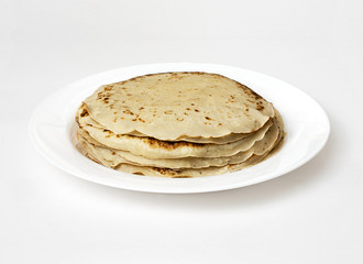 yellow pancakes on a white plate