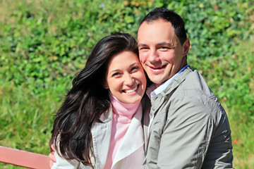 happy couple standing outside
