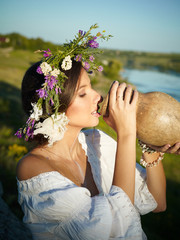 young woman drinking milk from a pitcher