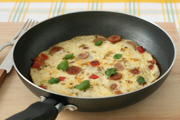 omelet with sausages and pepper