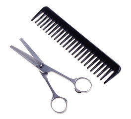 Hairdressing scissors and comb  isolated on a white background.