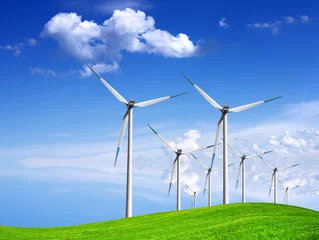 Foto auf Acrylglas Mühlen Windgeneratoren auf grüner Wiese