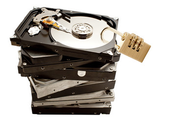 pile of hard disk drives with one on top showing protected data