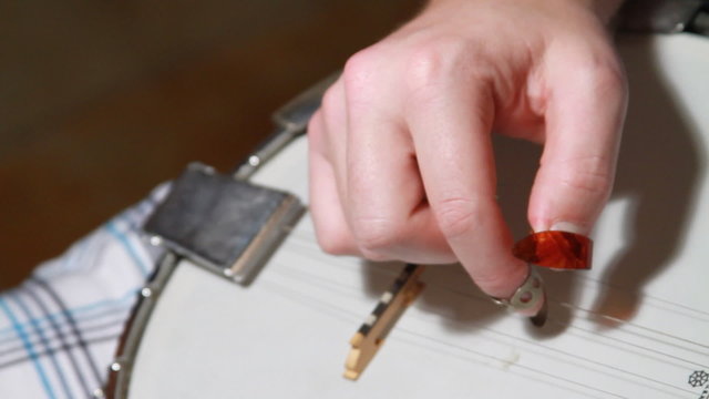 Young Adult Playing Banjo