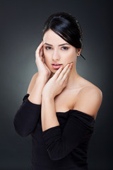 Fototapeta premium woman holding her face in hands