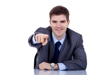 Naklejka premium business man at his desk pointing