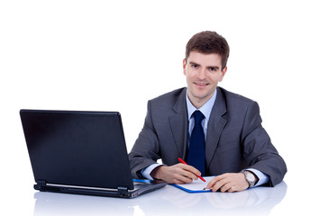 Fototapeta na wymiar Business man writting at desk