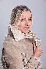 Portrait of blond woman wearing winter jacket