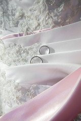 part of a dress with wedding rings