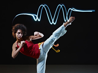 hispanic woman playing capoeira martial art