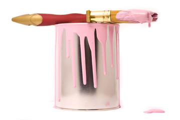 Can of pink paint and professional brush on a white