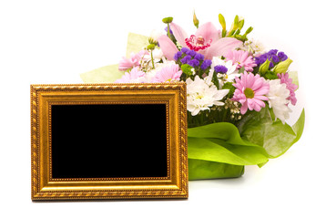 Beautiful bouquet and golden frame on a white
