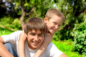 happy brothers in the summer park