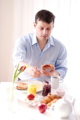man having breakfast at home