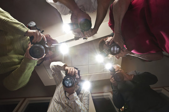 Paparazzi Photographers Shooting a Victim of Crime