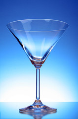 Martini glass on blue background