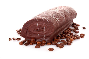 Cake and coffee beans isolated on white