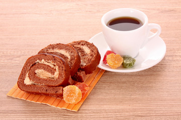 Piece of cake and coffee isolated on white