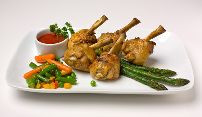 chicken legs with asparagus and ketchup