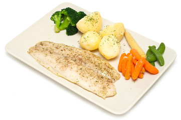 cod fillet with vegetables on white