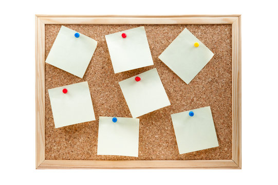 different sticky notes on a cork board isolated