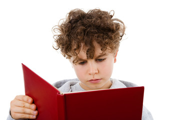 Boy reading book isolated on white