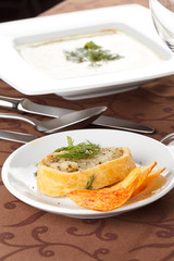 spinach cream soup with potato chips and fish pie