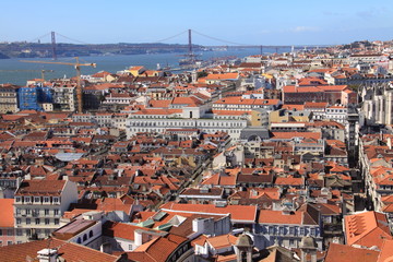 Bird way of central Lisbon with red roofs and river embankment