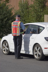 Police officer issuing speeding ticket