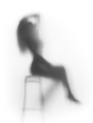 Sexy dancer sits on chair