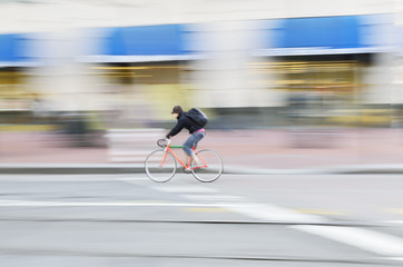 Urban cyclist riding at speed