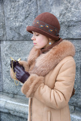 Woman in coat with vintage watch