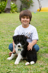 Boy with his Border Collie puppy